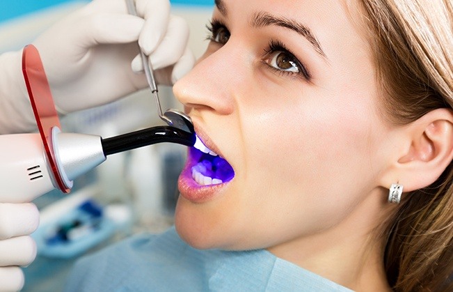 Patient receiving cosmetic dental bonding treatment