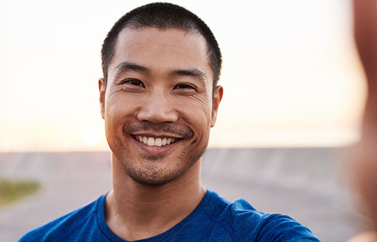 man smiling outside