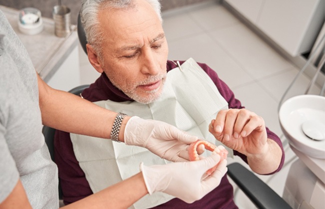 Man at the dentist getting dentures