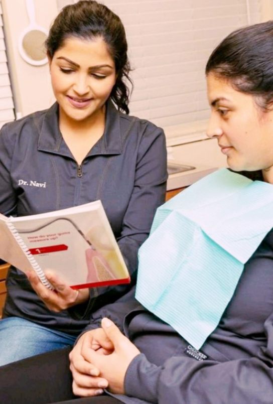 Dentist and patient reviewing gum disease treatment options