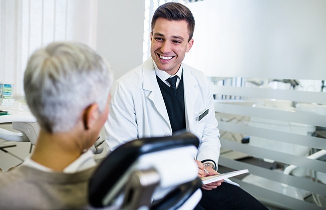 Doctor Ferguson talking to dental patient