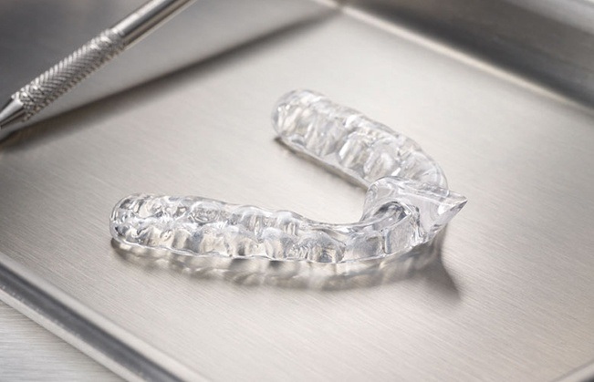 Clear nightguard for teeth grinding on metal tray