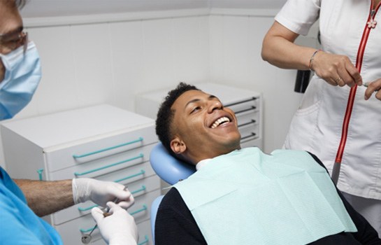 Smiling man in dentist’s chair