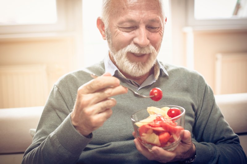 Patient about to eat with their dentures